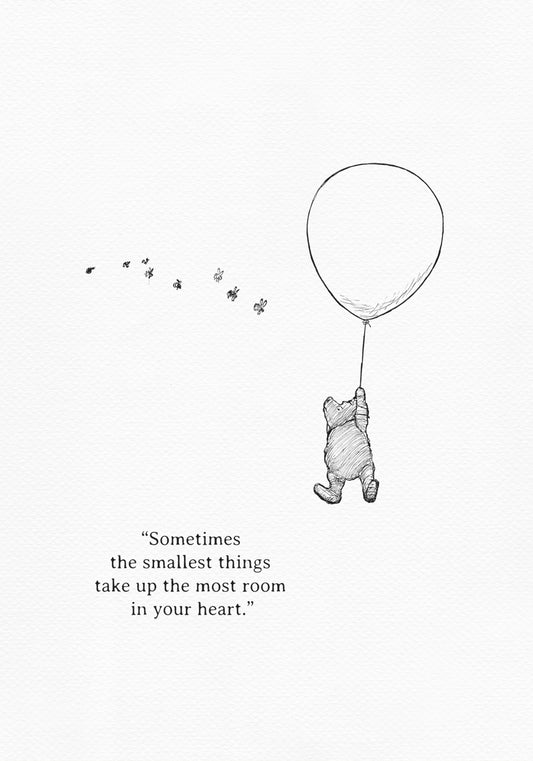 A black-and-white illustration showing Winnie the Pooh being lifted into the air by a balloon held in his paw. Bees are flying around him. The text 'Sometimes, the smallest things take up the most room in your heart.' is below the illustration.