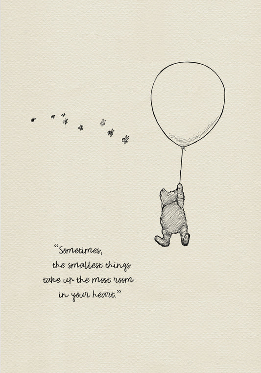 A black and white illustration of Winnie the Pooh holding onto a balloon. Winnie the Pooh is flying up into the air. There are small bees flying around him. The text reads 'Sometimes the smallest things take up the most room in your heart.'